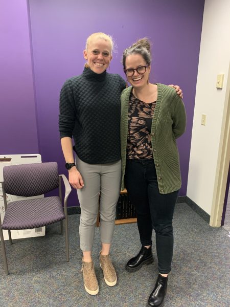 Bowman poses for a photo with her dissertation committee chair after passing her dissertation defense.