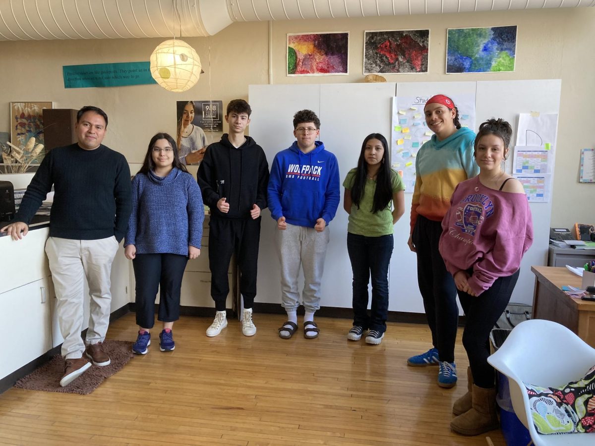 Latinos Unidos members pose for a photo after a meeting.