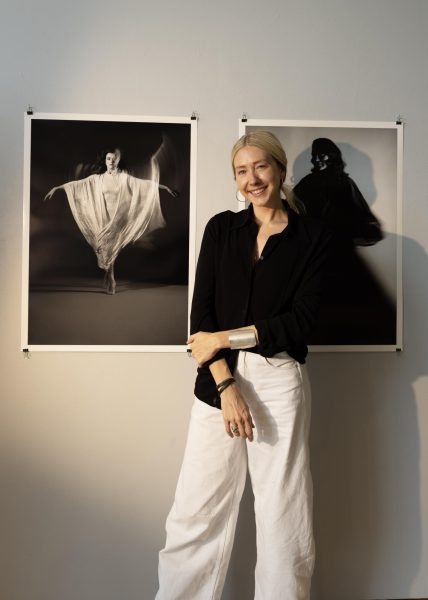 Traff stands in front of her pieces in the Bennett Gallery when the show was being set in August