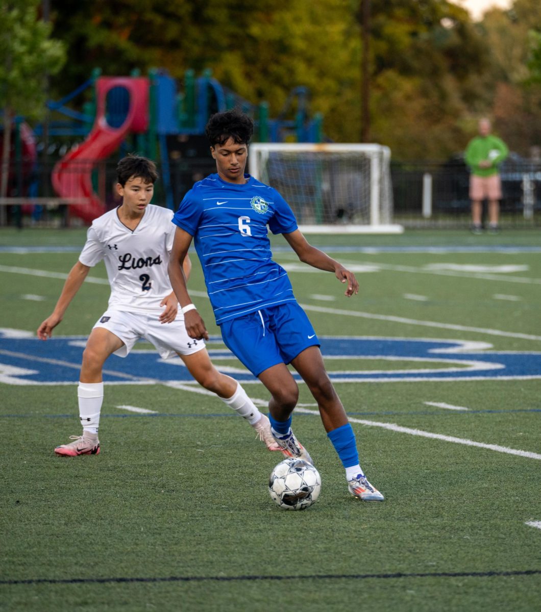 Vezmar, a varsity forward, dribbles past a Providence Academy defender during their 5-0 win vs. Providence on Sep. 5.