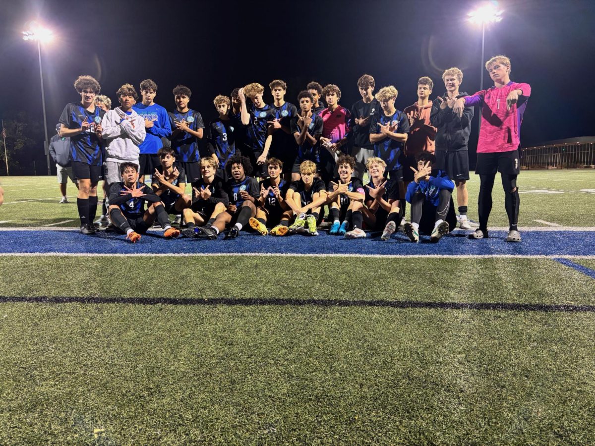 The Bears pose as a team after their victory. The celebration continued the next day when all the players wore their conference championship t-shirts. 