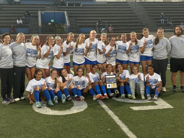 The Bears celebrated their IMAC championship on the field after the game with t-shirts and a plaque. 