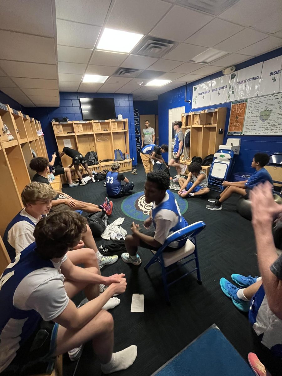 The team meets in the locker room before tryouts begin