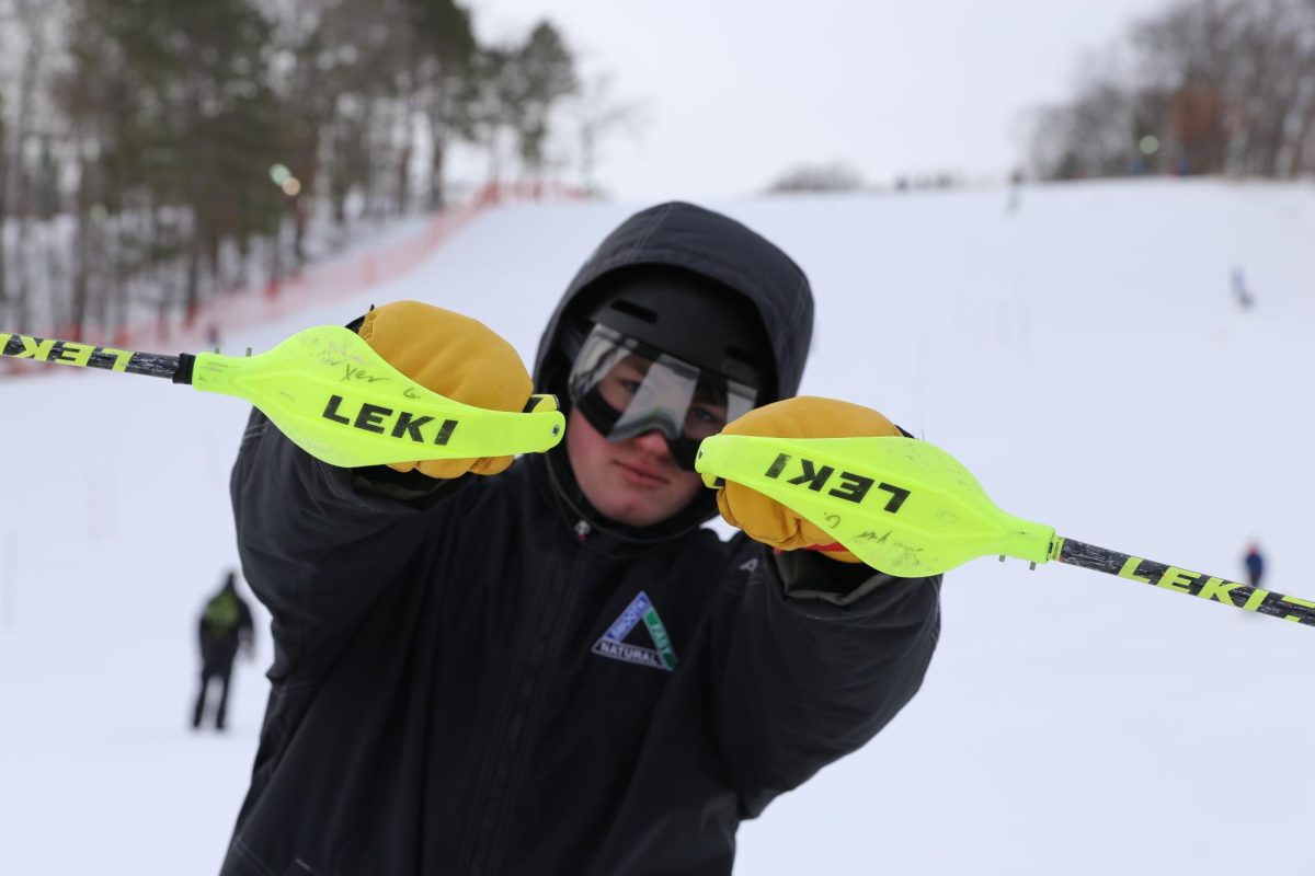 Captain Sawyer Guider ‘25 poses after a run at the Wild Mountain Invitational on Jan. 27.