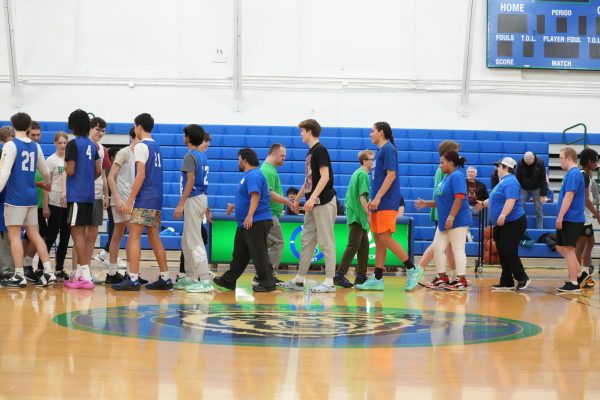 Students and athletes shake hands after a hard fought basketball game on Feb. 1.