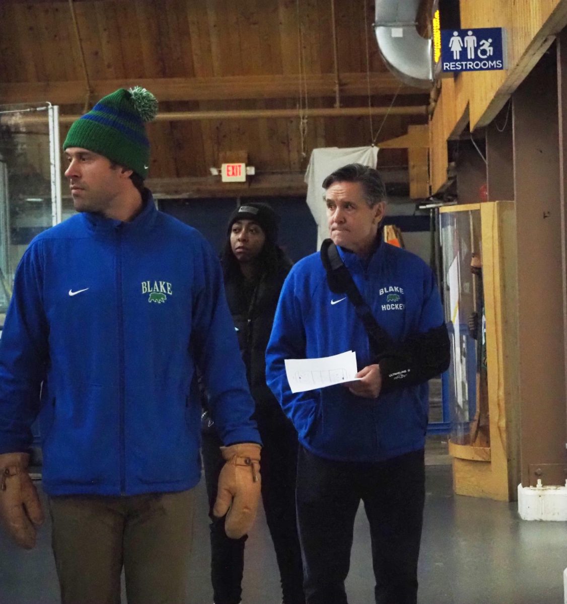 McClanahan (right) walks to the locker room after the first period of the Bears’ home opener against Mounds View alongside Wyman and athletic trainer Aubrey Dudley. Wyman, who has been involved with the team since 2015, was recently named McClanahan’s successor. “Blake Hockey has played a pivotal role in my life. I am honored and excited to be leading this program into the future. Thank you to the Blake community for entrusting me with this responsibility. I am excited and look forward to the challenge,” he said.