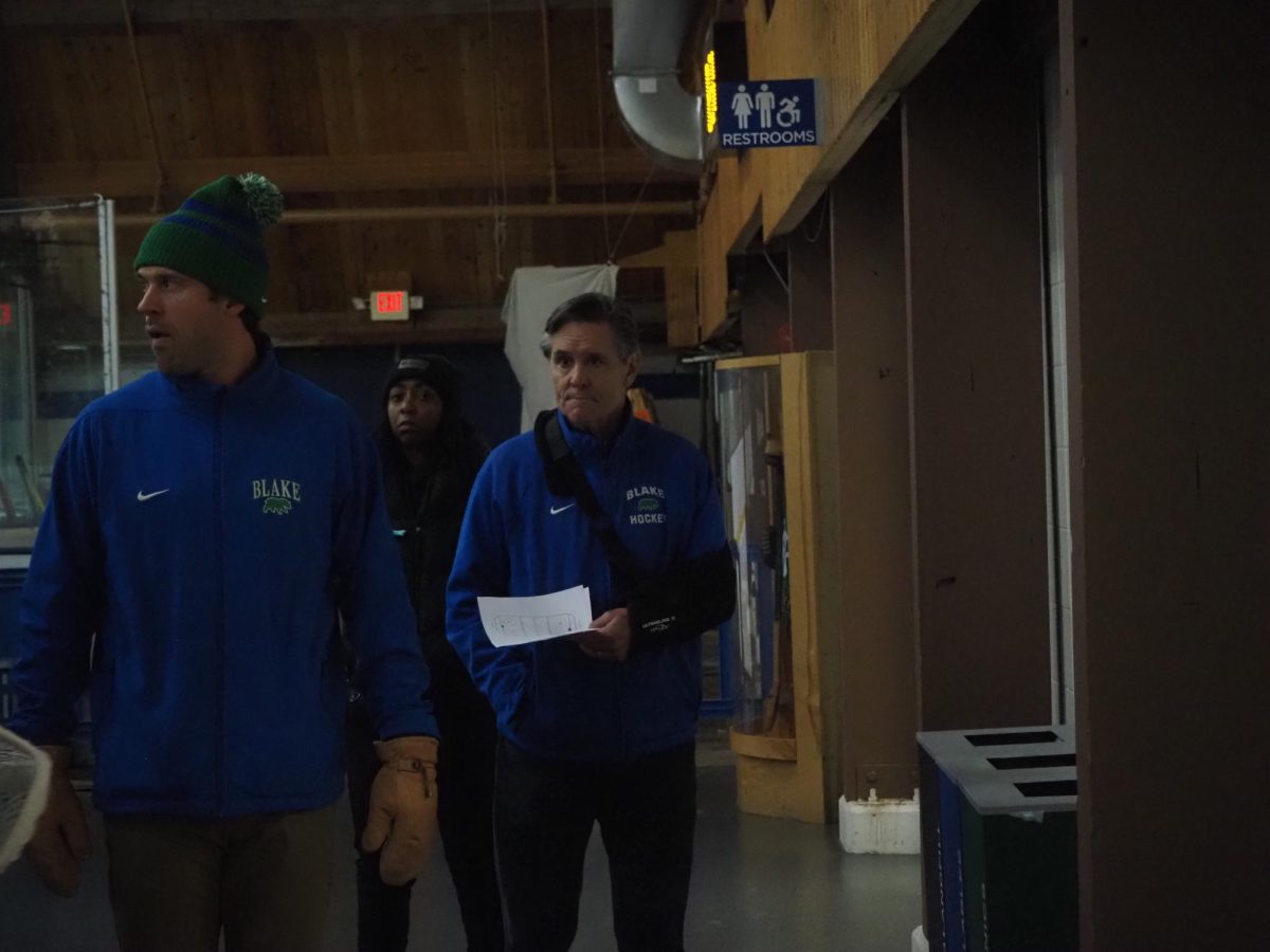 Coach McClanahan (right) walks away from the bench with Athletic Trainer Aubrey Dudley and JT Wyman. After serving as McClanahan’s assistant, Wyman has recently been  named the head coach form 2025-26. In a recent interview, Wyman told Spectrum, “Blake Hockey has played a pivotal role in my life. I am honored and excited to be leading this program into the future. Thank you to the Blake community for entrusting me with this responsibility. I am excited and look forward to the challenge.”
