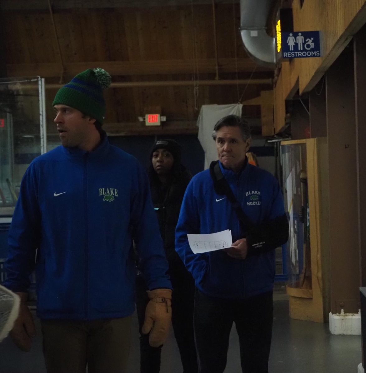 McClanahan (right) walks to the locker room after the first period of the Bears’ home opener against Mounds View alongside Wyman and athletic trainer Aubrey Dudley. Wyman, who has been involved with the team since 2015, was recently named McClanahan’s successor. “Blake Hockey has played a pivotal role in my life. I am honored and excited to be leading this program into the future. Thank you to the Blake community for entrusting me with this responsibility. I am excited and look forward to the challenge,” he said.