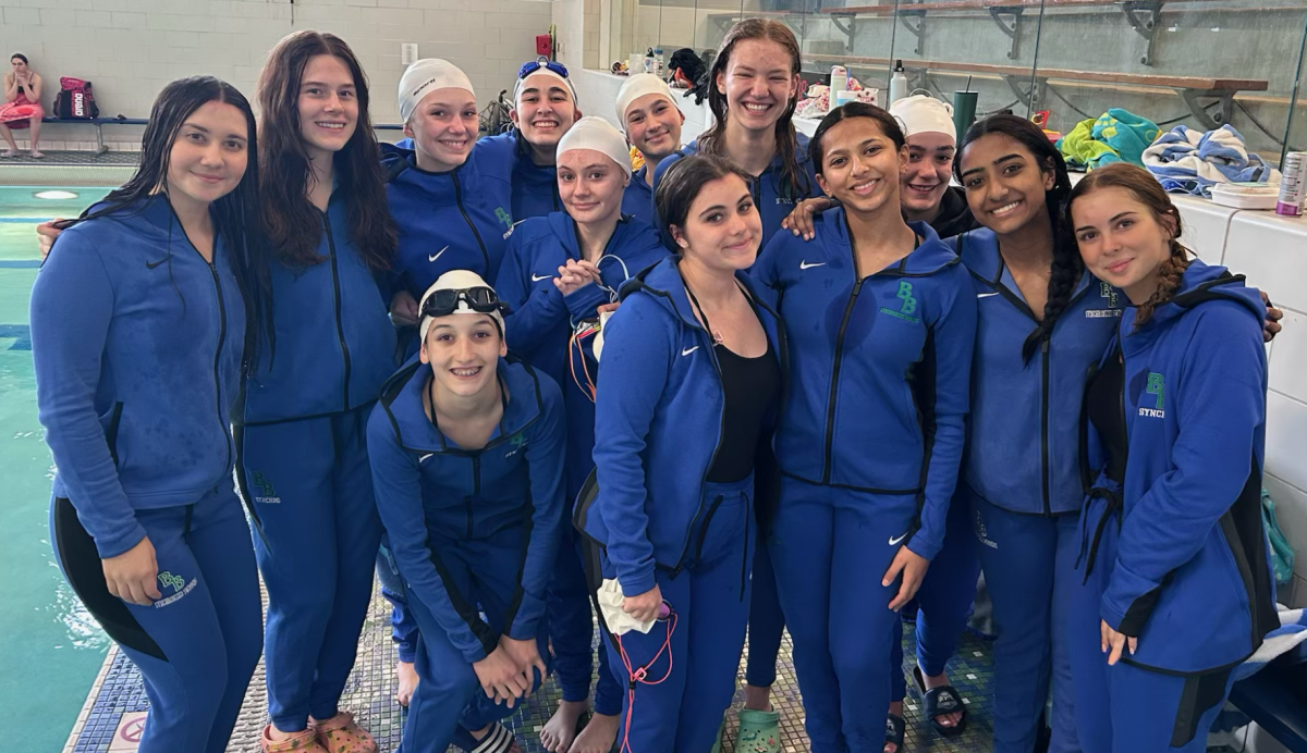 The team gathers for a group photo after the season’s first home meet against Saint Louis Park and Richfield. The meet took place on April 11.
